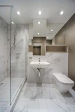A bathroom with wall and floor tiles