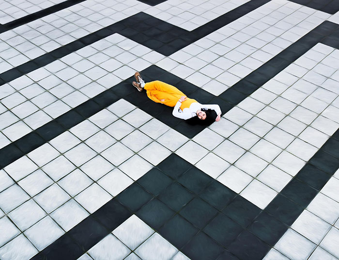Woman laying on tiles
